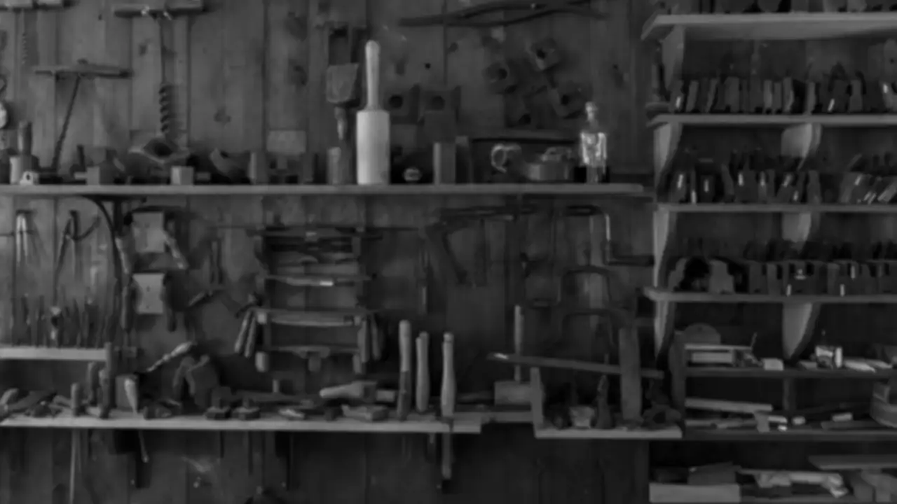 Hand tools on a wooden shelf